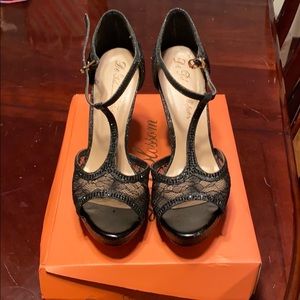 5-inch black lace T-strap heels. Size 8 1/2.